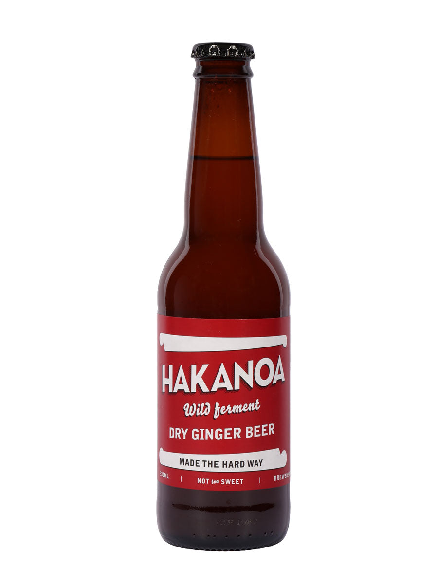 Hakanoa dry ginger beer bottle with a red label on a white background